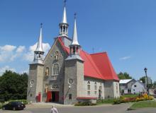 Èglise Sainte-Famille stands proudly with three bell towers — Île d’Orléans, eastern Canada. Photos by Julie Skurdenis
