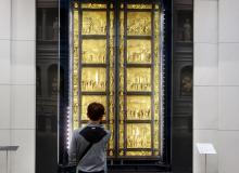 A visitor admires Lorenzo Ghiberti’s “Gates of Paradise” in Florence’s newly refurbished Duomo Museum. Photo by Rick Steves