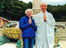 Sandra Yon and a monk at the Donghwasa Temple in Daegu.