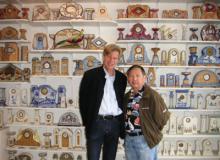 Selliers and visitor Lawrence Peacock in front of a selection of Jacques’ clocks