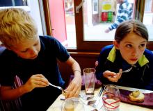 Travelers of all ages — here trying snails for the first time — can reach new gastronomic heights in France. Photo by Rick Steves