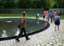 Sightseers visit Berlin’s new memorial honoring the Roma and Sinti victims of Hitler’s genocide. Photo by Rick Steves