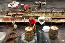 Workers at Scotland’s Speyside Cooperage fashion oak casks for aging Scotch whisky.