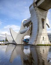 The Falkirk Wheel, the world’s only rotating boat lift, connects the Forth & Clyde and Union canals in central Scotland. Visitors can take a round-trip boat ride, ascending and descending through the wheel, in an hour.