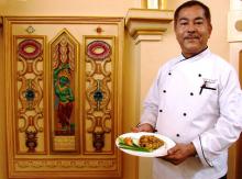 Chef Keshab Ram Shrestha, executive chef at Hotel Shanker in Kathmandu, presenting a dish of Chicken Choyala in the dining room. Photos by Sandra Scott