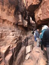 Caravan-Serai tour members walking in Wadi Rum, Jordan, after camping overnight. Photo by Rita Zawaideh