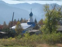 An Eastern Orthodox church in a small farm village in Russia.