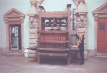 JoAnn Kofoed beside an antique wine press in Beaune. Photo: Bill Kofoed  