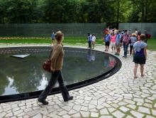 Sightseers visit Berlin’s new memorial honoring the Roma and Sinti victims of Hitler’s genocide. Photo by Rick Steves