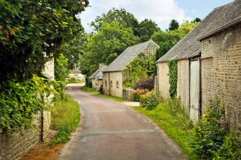 Normandy’s little lanes, cute stone houses, and lush greenery are irresistible. Photo by Dominic Arizona Bonuccelli