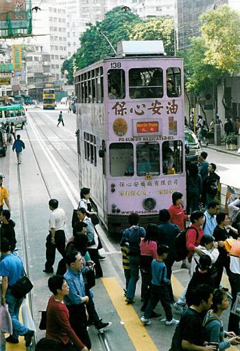 We rode through Hong Kong in the front seats of the top level on a double-decker tram like this one.
