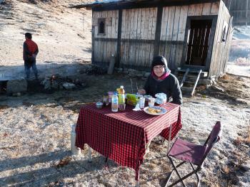 Lois enjoying breakfast, one of the delicious, made-from-scratch hot meals we had on our trek (including lunches on the trail).