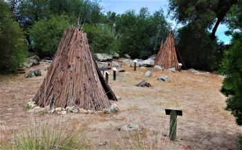 Traditional Miwok redwood-bark houses at the Coarsegold Historic Museum in Coarsegold, California.