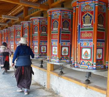 Pilgrims spinning prayer wheels at Labrang Monastery.