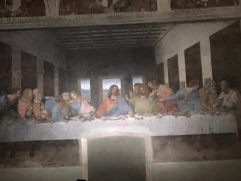 Leonardo da Vinci's “The Last Supper” — Church and Dominican Convent of Santa Maria delle Grazie, Milan, Italy. <i>(Note how, years ago, the monks cut a door through the bottom of the painting and destroyed Jesus’ feet.)</i>