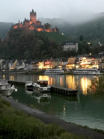 View of the Imperial Castle in Cochem from the bridge at dusk.