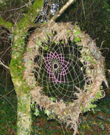 Along the Sun Trail, “spiderwebs” of branches and yarn can be found. 