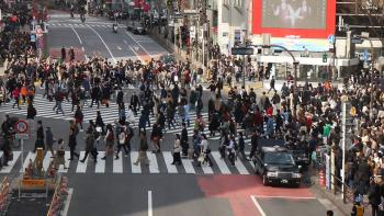 Pedestrians at Shibuya Crossing in Tokyo. (About 2,500 people cross the intersection at a time.)