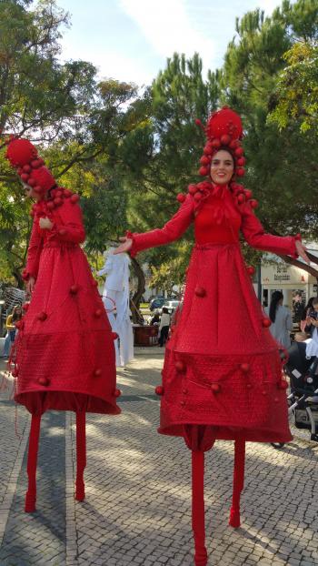 Costumed performers on stilts at the Quarteira Christmas pageant — the Algarve, Portugal.