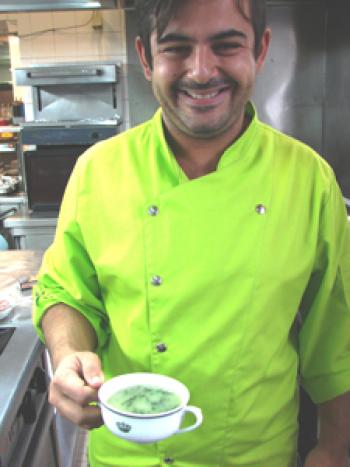 Presenting a serving of Sopa Caldo Verde, Chef Duarte Catela of the Cozinha Velha – Queluz Restaurant.