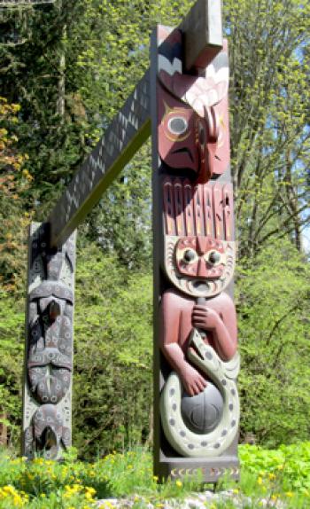 Coast Salish welcome gate poles carved by Susan Point — Brockton Point in Stanley Park, Vancouver. Photo by Julie Skurdenis