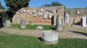Wall of antiquities near the Cathedral of Santa Maria Assunta — Torcello island, Venetian Lagoon, Italy.