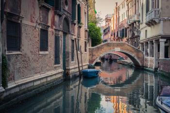 Venice canal with gondola. Photo by Dreamstime/TNS